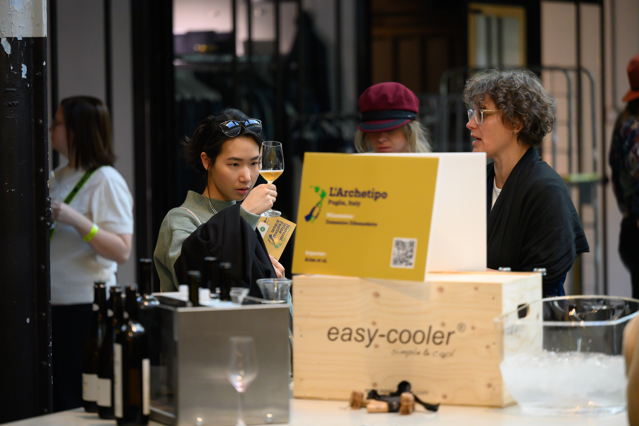 visitors tasting at a winemaker's table